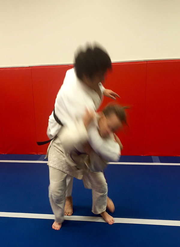 Student in gi practicing a Danzan Ryu Jujitsu technique at a Kodenkan Yudanshakai dojo.